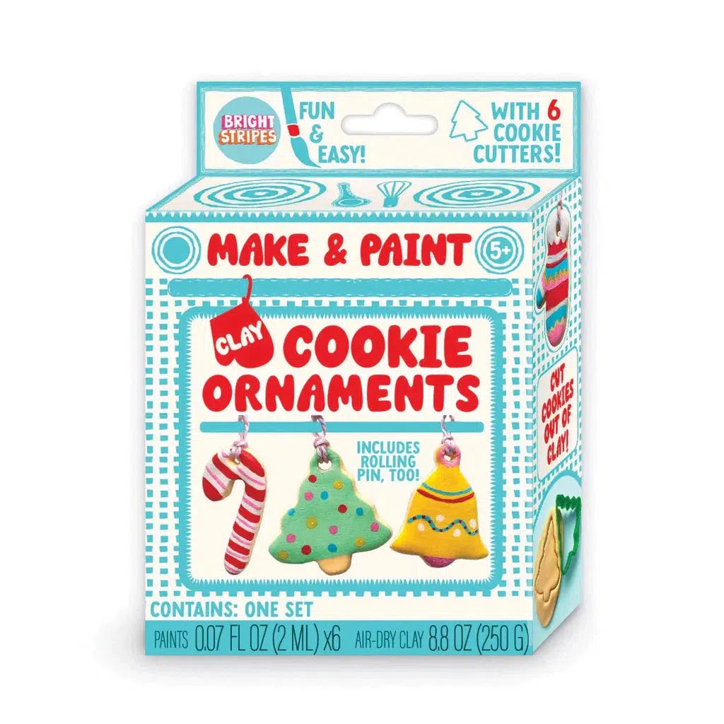 Box for "Make and Paint Clay Cookie Ornaments" kit, featuring air-dry clay. Includes 6 cookie cutters and paints. A festive activity for ages 5+.