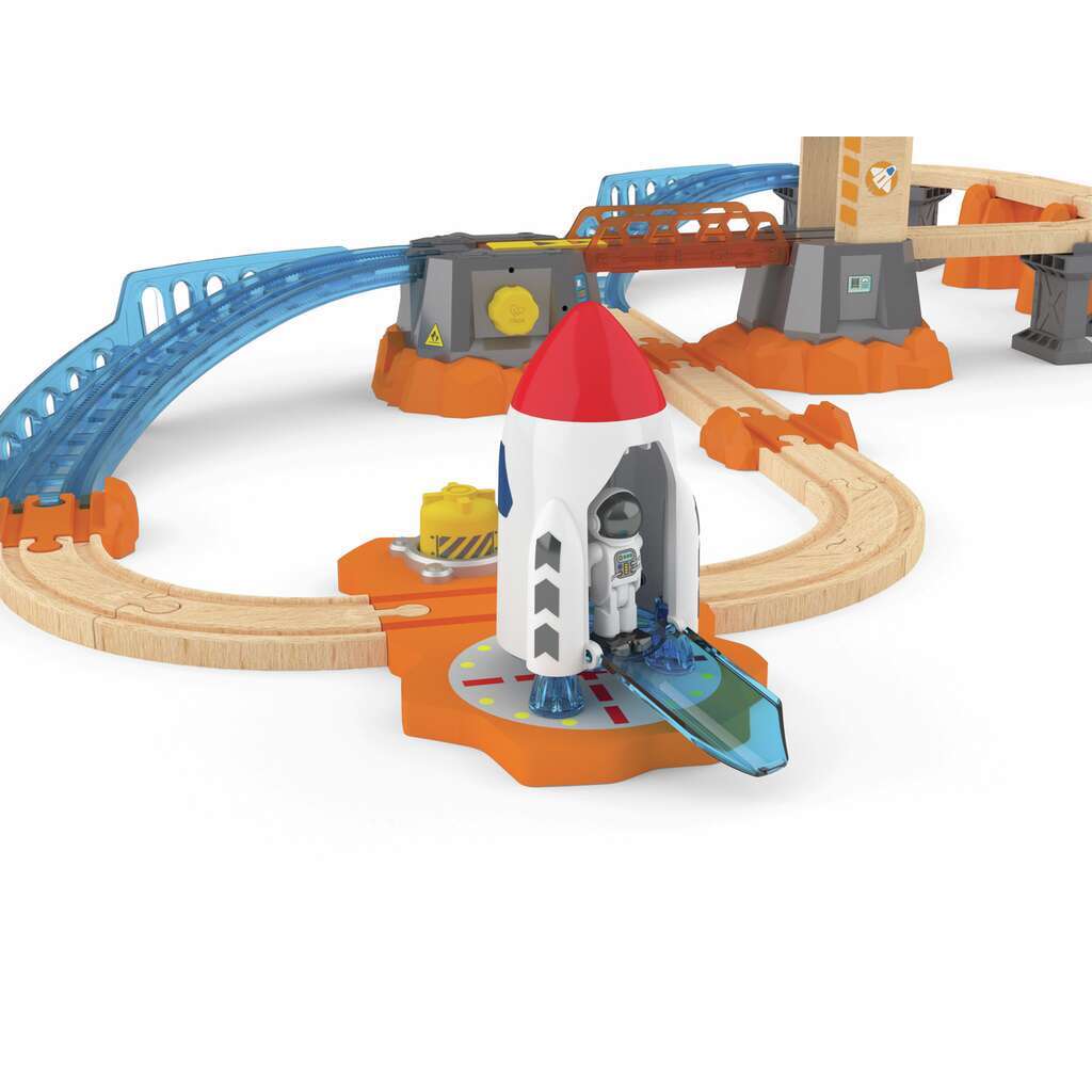 Experience railway excitement with this toy train set featuring wooden tracks, a red and white rocket ready for launches, and various structures including a blue bridge and a towering station. Perfect for igniting imaginative play in young engineers!