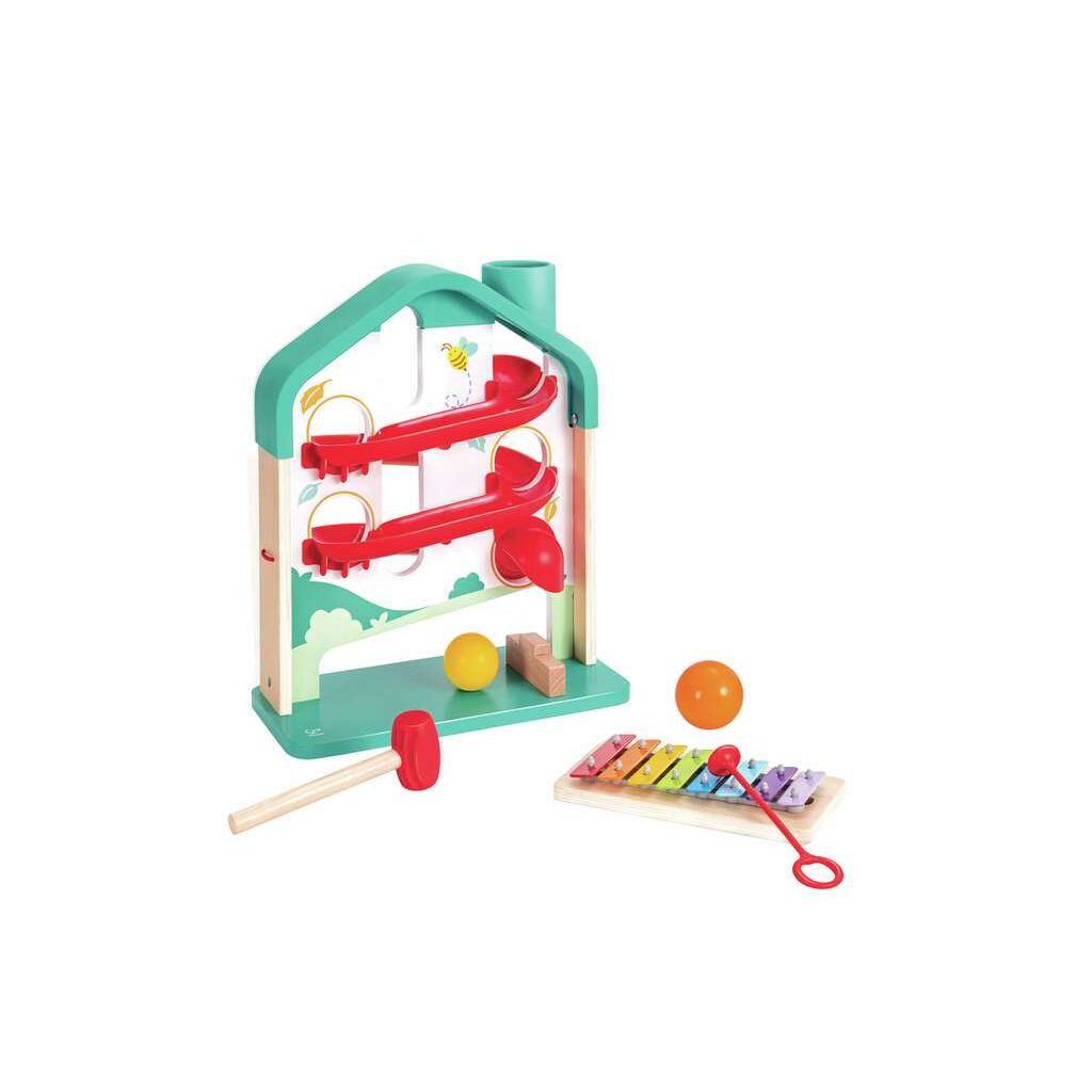 This vibrant toy set resembles a house-shaped ball rolling game, featuring a cascading track for two balls, a mallet, and a small xylophone board.