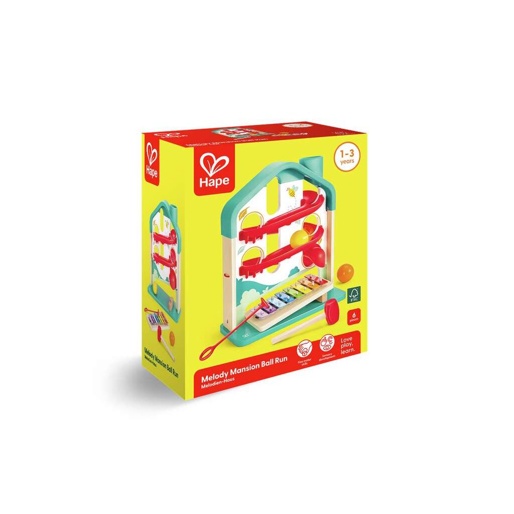 The image shows a Hape Melody Mansion Ball Run box, featuring a colorful toy house with a ball rolling game and musical xylophone board. Recommended for ages 1-3.