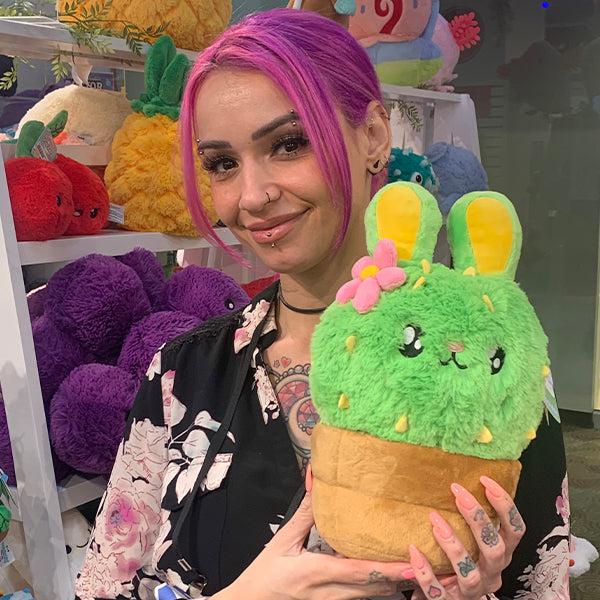 Person holding cactus bunny plush