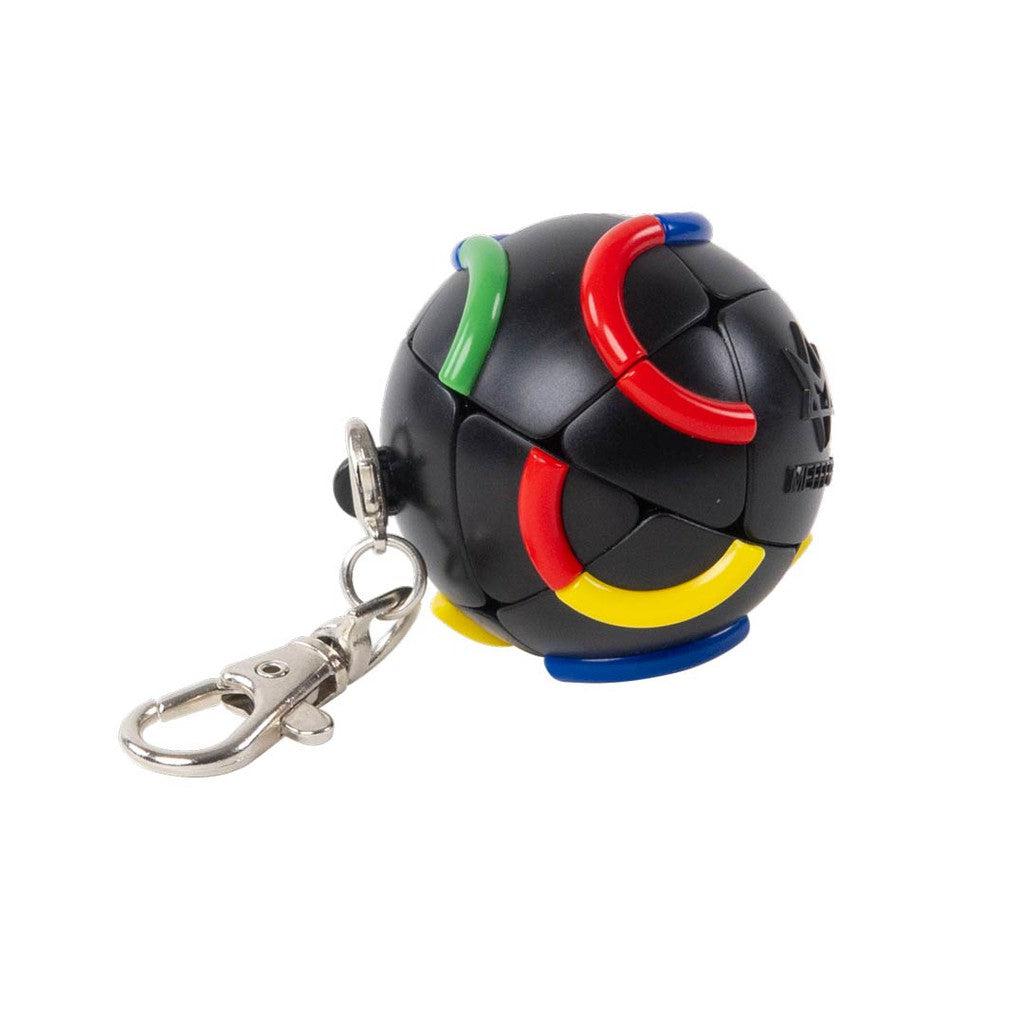 A black spherical keychain with colorful curved segments and a metal clip on a plain white background.