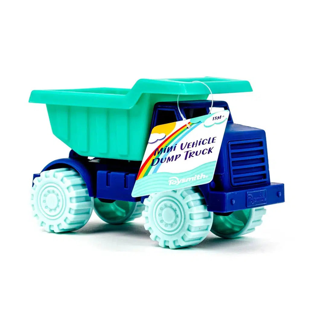 A toy dump truck crafted from durable plastic features a blue cab and turquoise dump bed, complemented by white wheels. A tag reading "Mini Vehicle Dump Truck" is attached to the side, highlighting its robust design.