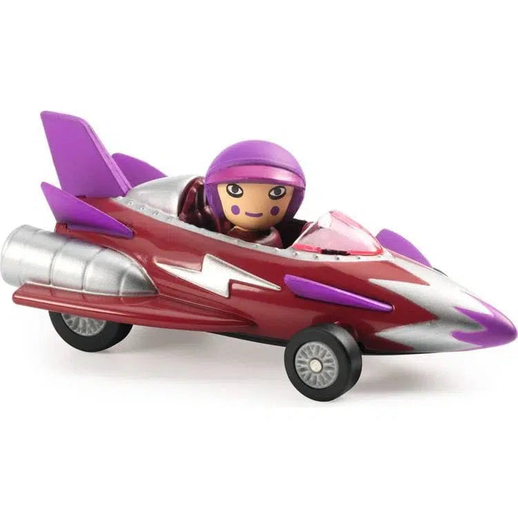 Toy figure in a purple helmet is seated in a sleek metal rocket car with purple wings and wheels, adorned in ultrasonic metallic paint that gives it a striking red and silver sheen.