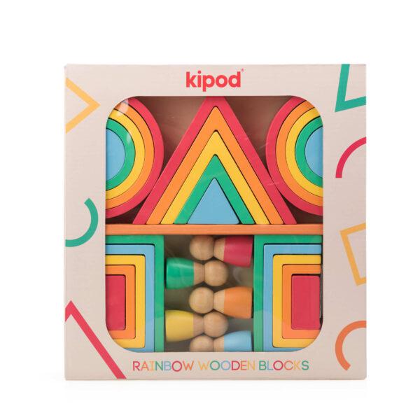 A boxed set of Kipod rainbow wooden blocks, featuring colorful triangular and rectangular shapes with small wooden peg figures, perfect for continuous play and fostering imaginative toy scenarios.