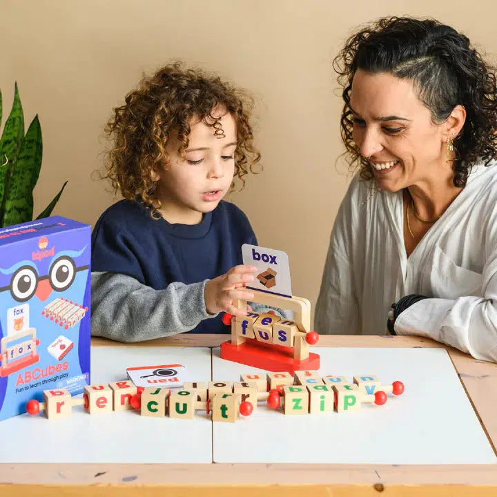 Parent and child playing with reading blocks