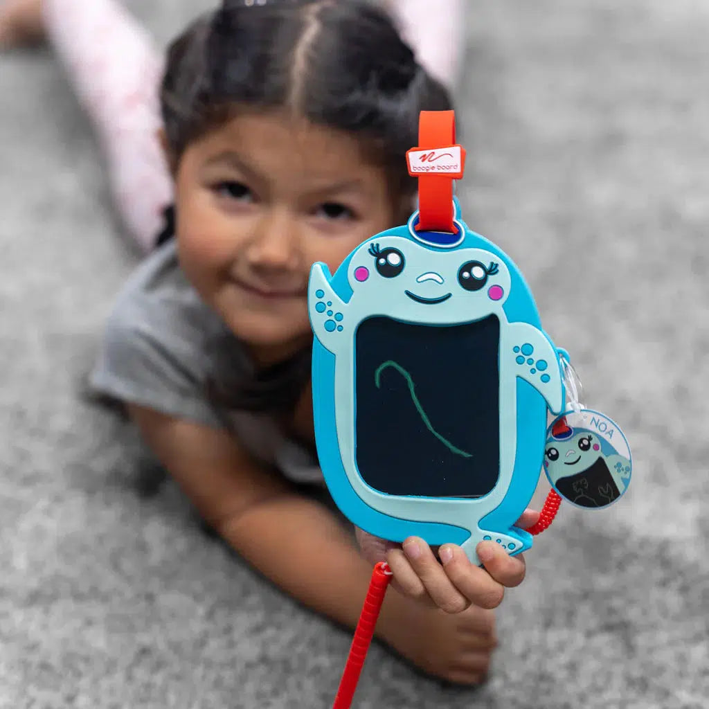 a child is drawing a single line on the boogie board, but noa is proud of the drawing and so should you. 