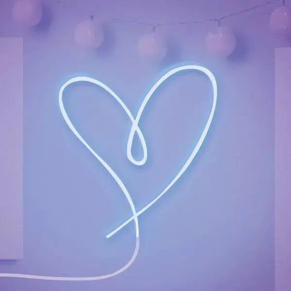 A neon light shaped like a heart