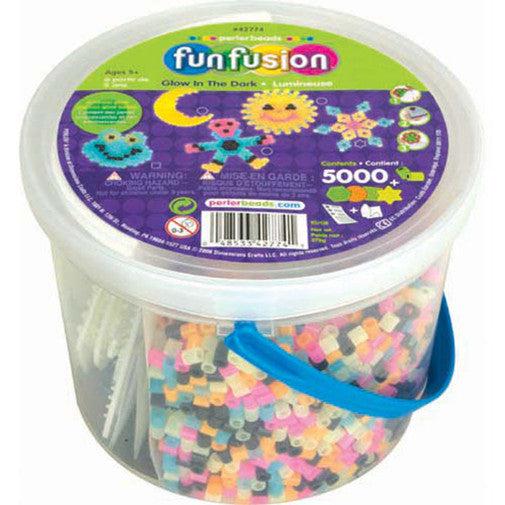 A plastic tub labeled "funfusion" containing Perler glow-in-the-dark beads and pegboards, with 5000+ pieces.