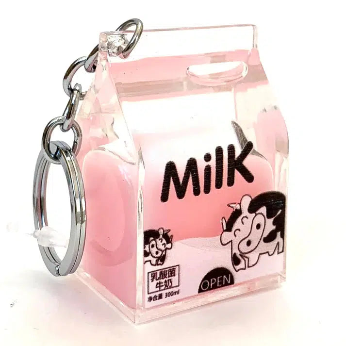 This Pink Milk Charm is a delightful key ring shaped like a small milk carton, complete with pink liquid inside and labeled "Milk." Adorned with a whimsical cow illustration, it adds a touch of playful charm to your everyday essentials.
