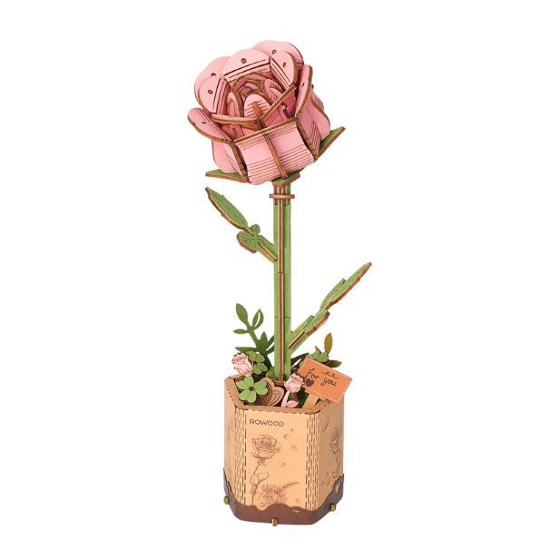 A diy wooden model of a pink rose on a stem