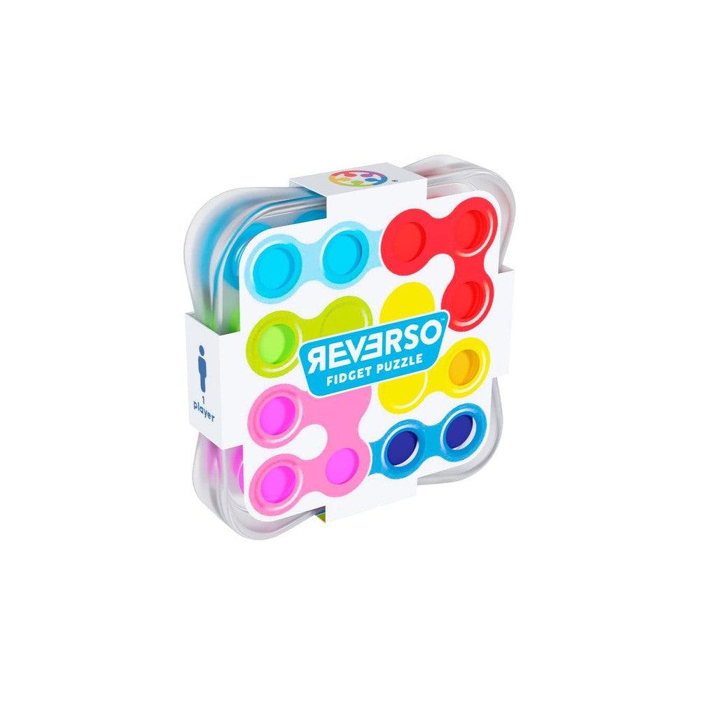 A colorful Reverso fidget puzzle in plastic packaging, featuring multicolored circular and square shapes.