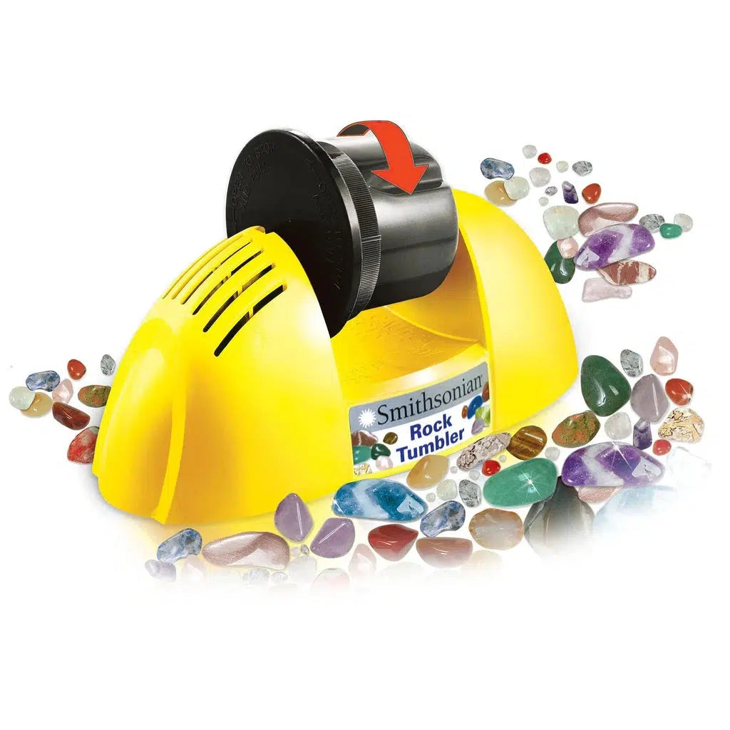 A vibrant yellow Smithsonian Rock Tumbler with a sleek black barrel nestles amidst an array of polished, colorful stones.