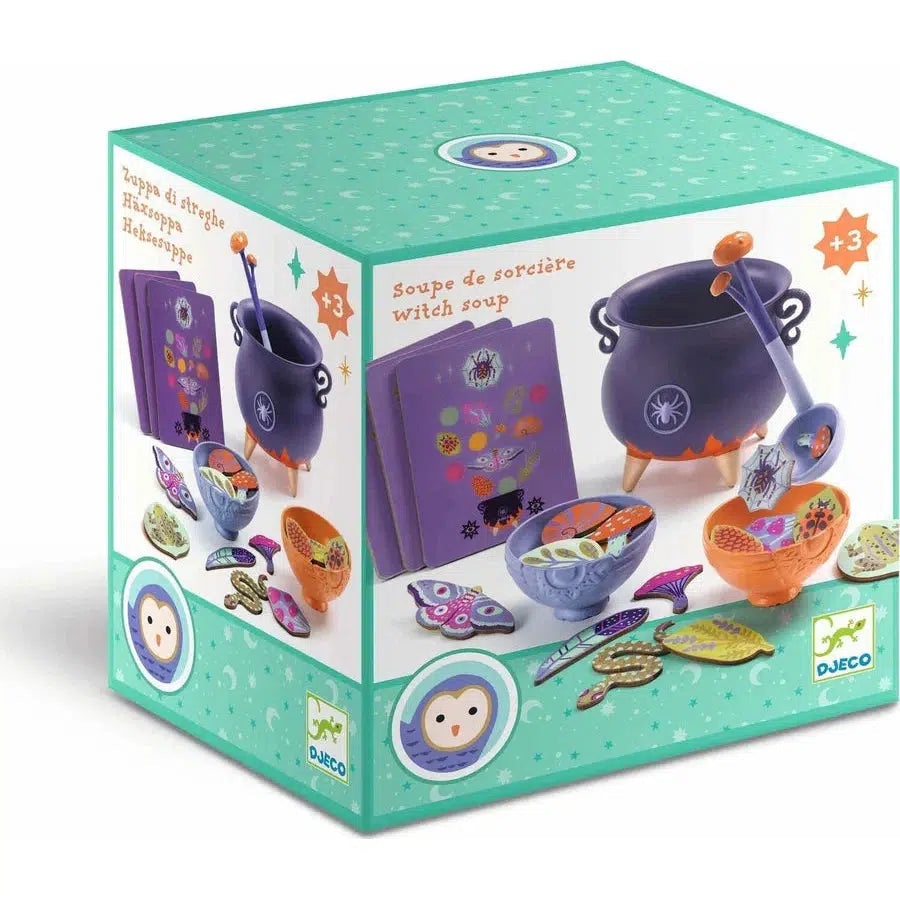 A box of "Witch Soup" toy set by Djeco, featuring a purple cauldron, ladle, bowls, ingredients, and a recipe book. Suitable for ages 3 and up.