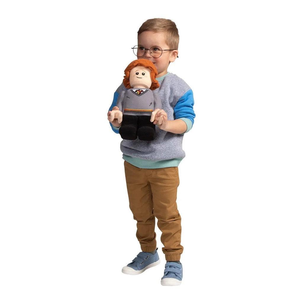 Ron Lego Plush-Manhattan Group-child holding Ron plush