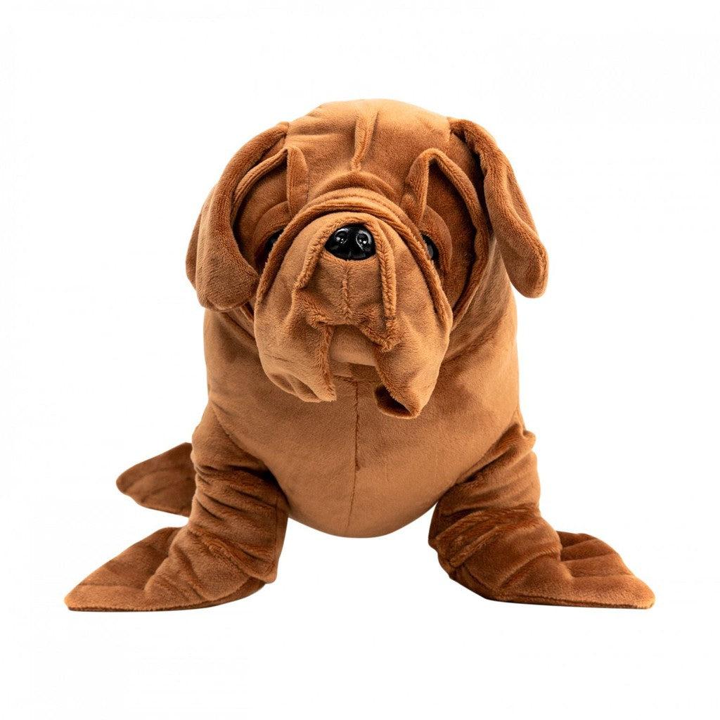 A plush dog toy with droopy ears and a wrinkled face, resembling a brown bulldog, sits on a plain black background—a stuffed toy delight that brings the charm of a hybrid animal to life.