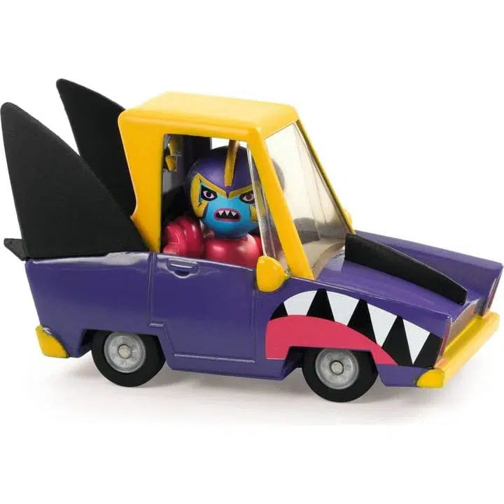 A colorful Shark car with shark features and a fierce-faced figure inside, showcasing sharp teeth decals on the sides. The metallic paint gleams brilliantly, adding an extra layer of allure to its overall dynamic appearance.