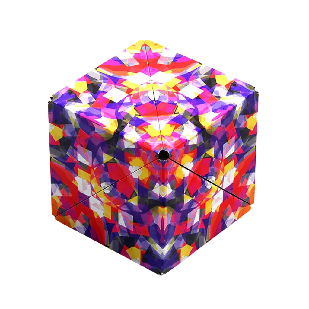 A colorful geometric cube with a kaleidoscopic pattern featuring vibrant reds, yellows, purples, and blues, magically held together with rare earth magnets from Shashibo.