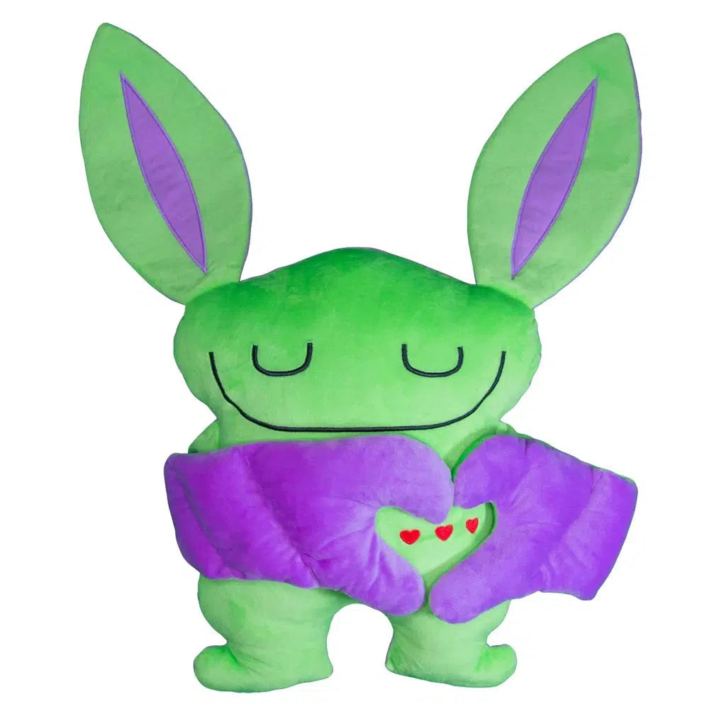 A green plush toy with closed eyes, large purple ears, and arms forming a heart shape with small red hearts inside.