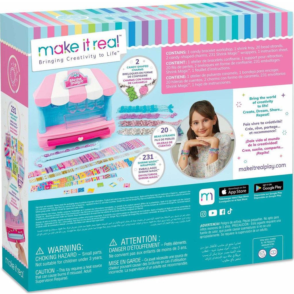 A colorful DIY jewelry kit box, resembling a Shrink Magic Candy Shop, features a girl showcasing her bracelet. Packed with product details and safety warnings, this vibrant set offers treats to wear as colorful accessories with playful design elements.