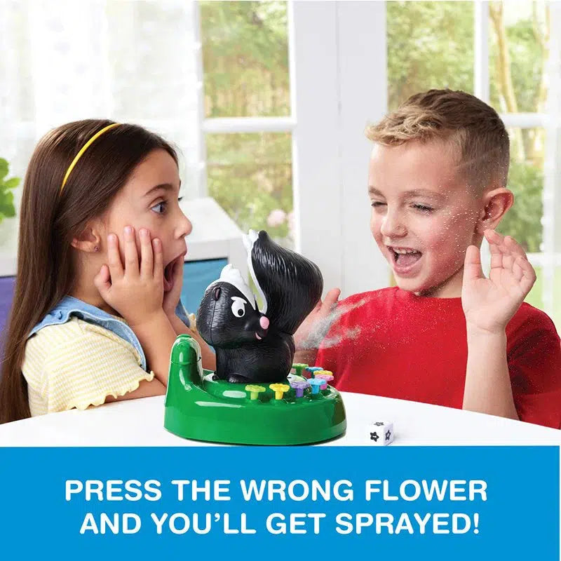 Two children enjoy the Skunked Game by Epoch Everlasting Play, featuring a skunk-themed toy that sprays water. A girl looks surprised while a boy laughs as he gets skunk sprayed. Text reads, "Press the wrong flower and you'll get sprayed!