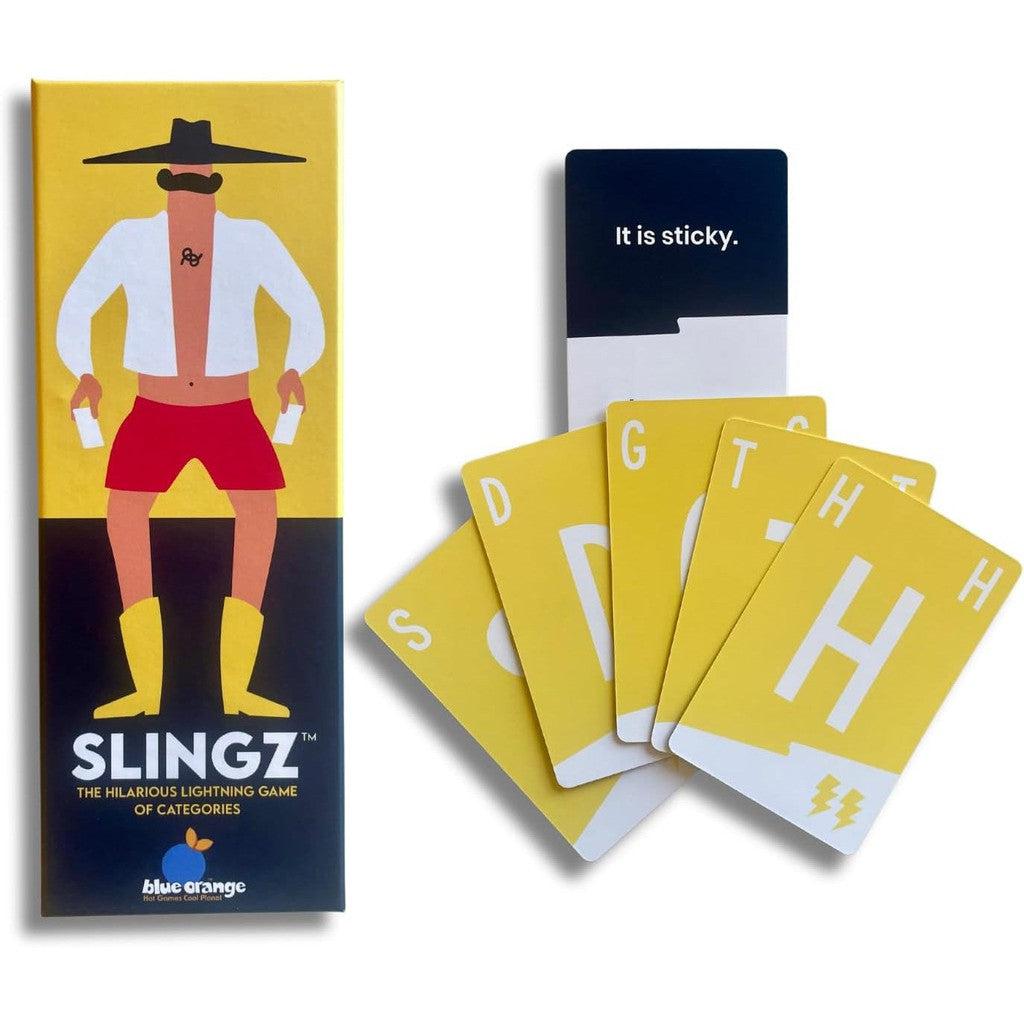 A box of "Slingz" card game from Slingz Games features a lively cartoon character. Four yellow cards with letters and a booklet with "It is sticky" text are displayed, making it an ideal choice for your next word card party game.