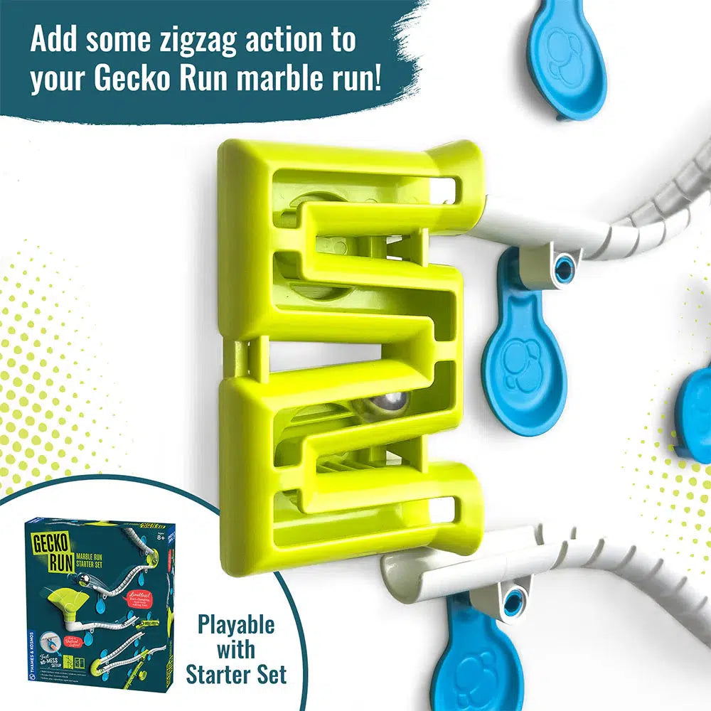 Close-up of a green zigzag track attachment for the Gecko Run marble run, featuring blue and white pieces. The text highlights its compatibility with the starter set. With vertical tracks made from eco-friendly materials, it promises endless fun. Box of the product shown in the corner.