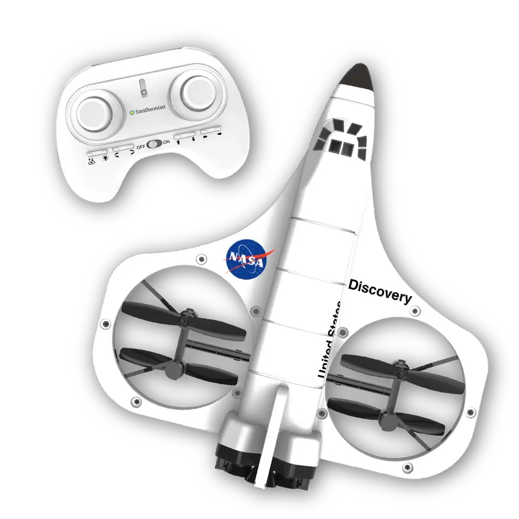 A white toy Space Shuttle drone with a NASA logo and propellers, ready to explore new horizons, is paired with a white remote control featuring two joysticks.