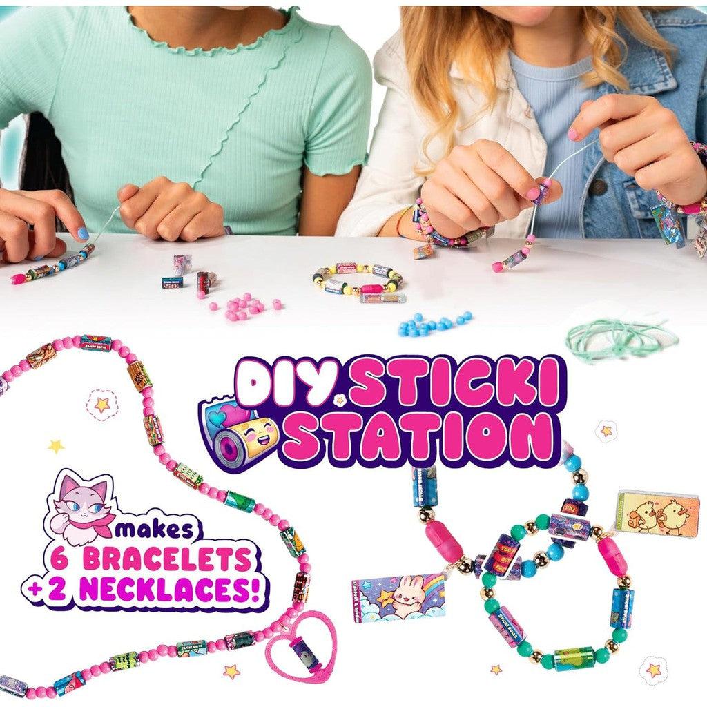 Two people creating bracelets and necklaces with colorful beads and charms. Text: "Dive into the fun with our DIY Sticker Jewelry Kit—make 6 bracelets + 2 necklaces! Part of the Toys &amp; Games collection.