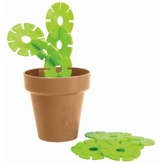 This witty gift features a Toysmith toy cactus crafted from green plastic rings in a brown pot, with additional rings scattered nearby. Perfect as a succulent sculpture for the playful at heart.