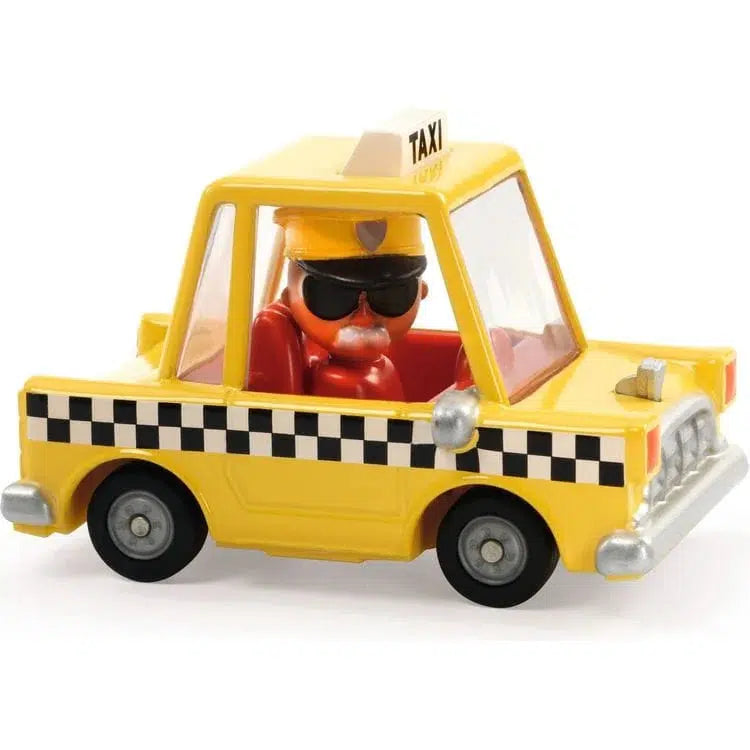 The toy taxi, reminiscent of a classic New York yellow cab, features a sleek yellow body adorned with a black and white checkered stripe. Inside, a driver figure sporting sunglasses and a hat completes the scene with vivid authenticity. Its metallic paint gleams under the light, capturing attention effortlessly.