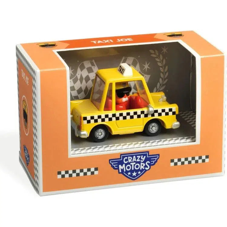 A toy yellow taxi car with metallic paint sits in a decorative box labeled "Crazy Motors," featuring checkered designs reminiscent of New York streets and the name "Taxi Joe" proudly displayed on top.