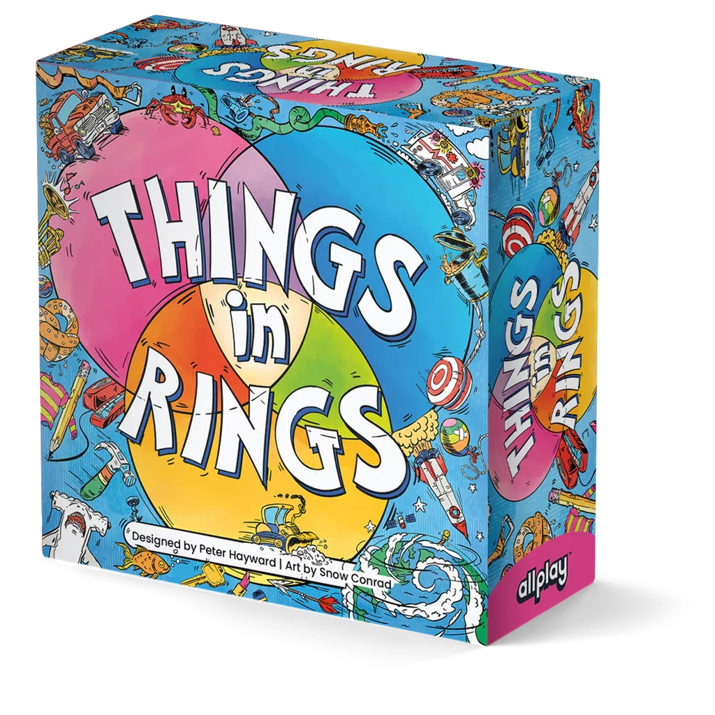 Things in Rings a game designed by Peter Hayward with art by Snow Conrad. A small square box covered in colorful drawings featuring all sorts of cars, animals, and objects