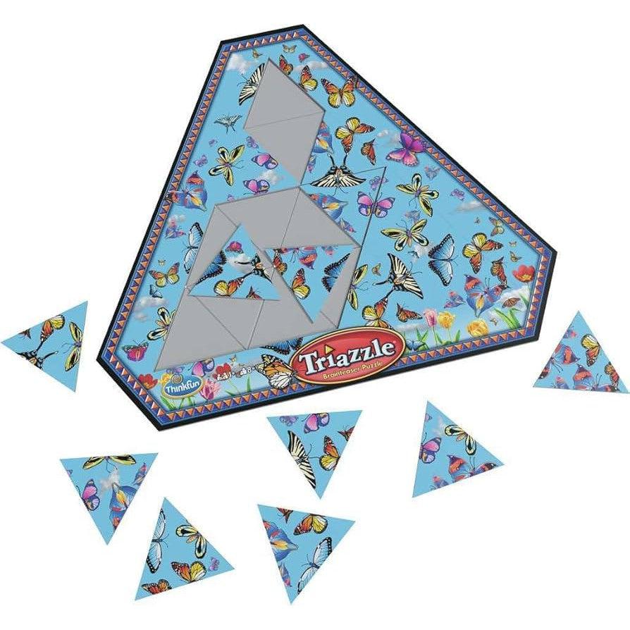 A triangular jigsaw puzzle with butterfly patterns, partially assembled on a blue background with scattered triangular pieces.