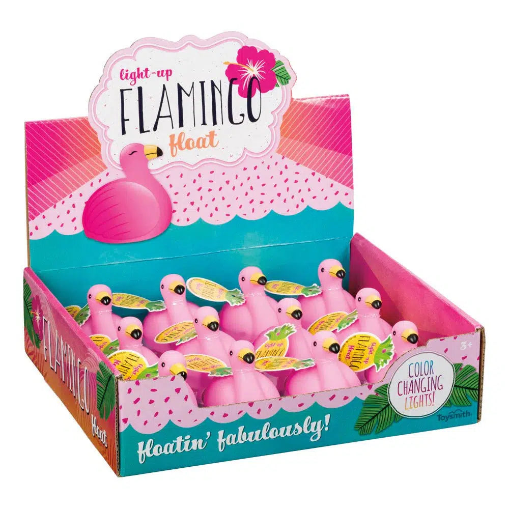 Display box with pink floating flamingo bath toys. The vibrant box, in bright pink and green, boasts "Color Changing Lights" that promise to make your bath time floatin’ fabulously magical!.