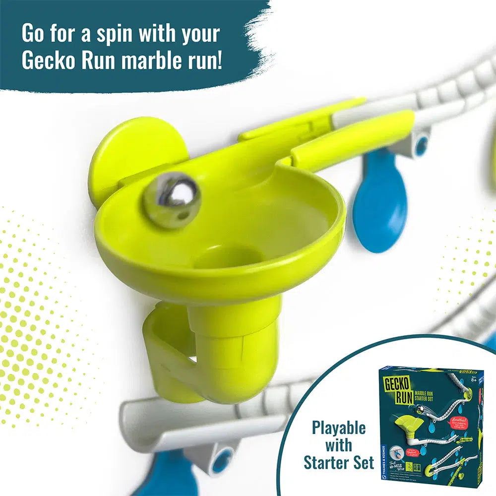 Introducing the Gecko Run marble run expansion pack, featuring a vibrant green funnel and sleek vertical tracks. Enhance your adventure with a marble and box labeled "Playable with Starter Set," adding new dimensions to your imaginative play.