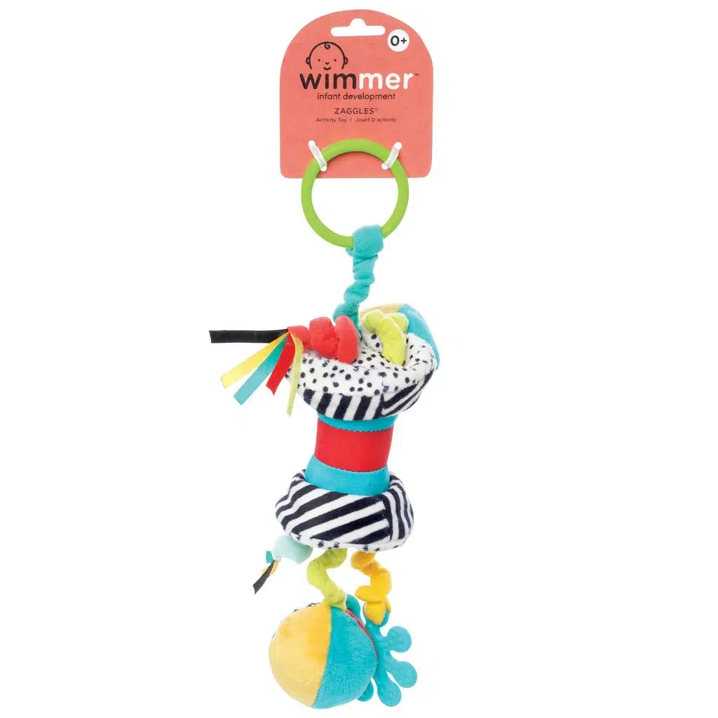 Colorful infant development toy, perfect as a take-along toy, with hanging soft shapes, a green ring on top, and multiple textures and patterns designed to stimulate sensory play and engage your baby's senses.