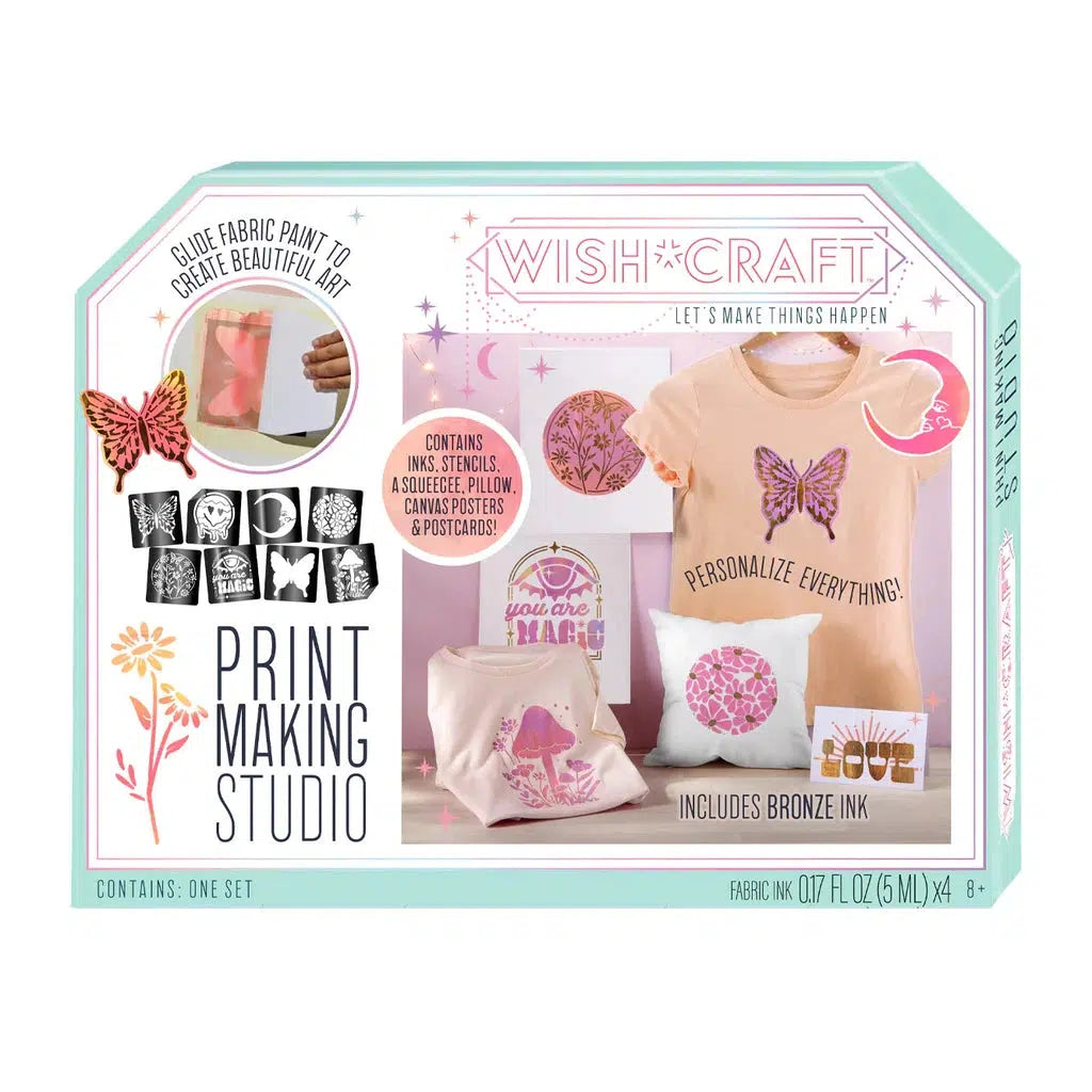 A printmaking studio kit with fabric paint, reusable sticker stencils, pillows, canvas, and postcards. Includes bronze ink for customizing fabric items like a t-shirt and cushion with your unique designs.