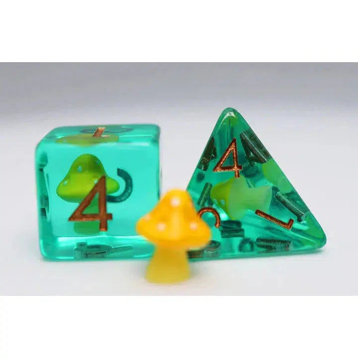 Two teal dice, perfect for Dungeons and Dragons, one triangular and one cubic, each with a small yellow mushroom inside, sit beside a larger yellow mushroom figure.