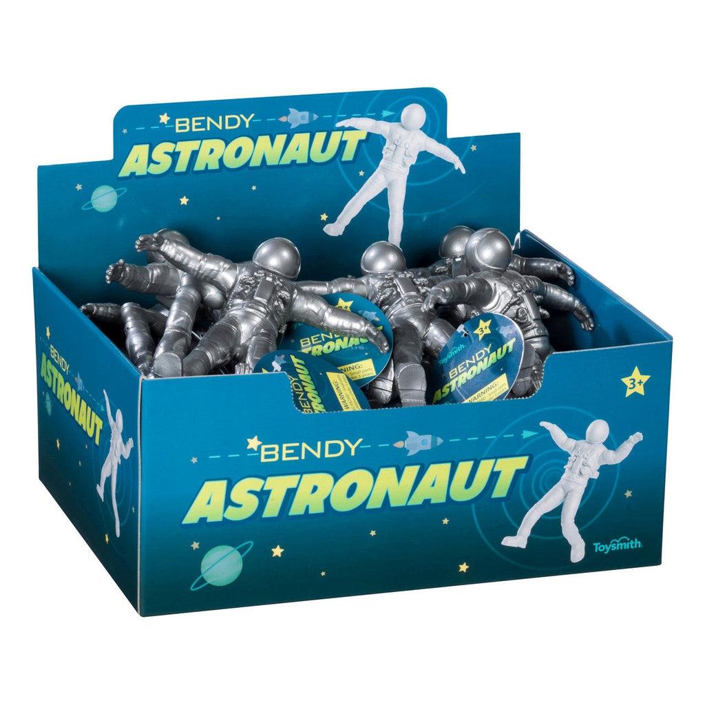 Silver toy astronauts in a blue box